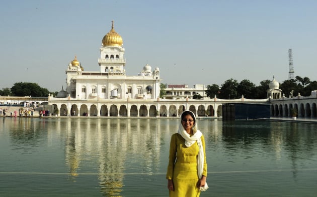 The majestic Guru Bangla Sahib Gurdwara throws its resplendent reflection in the pond