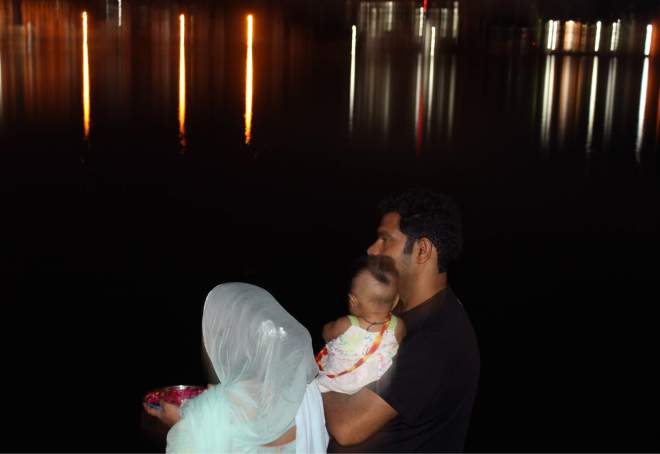 A couple offering Puja at Pushkar Lake Ghat, Pushkar