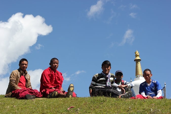 Chilling with young monks on the sunny slopes of Tawang