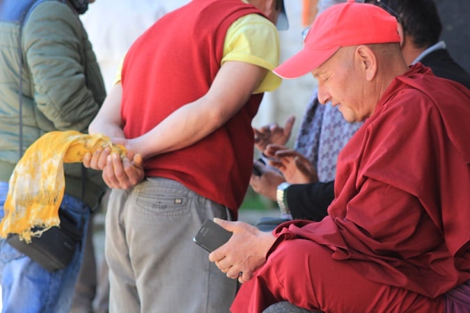 Monks at Tawang monastery on their smartphones