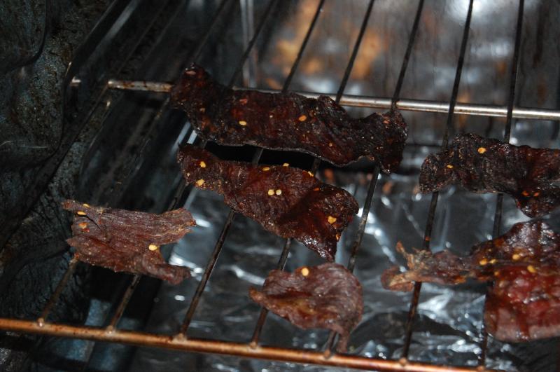 Beef sprinkled with chilly flaked while being smoked dry