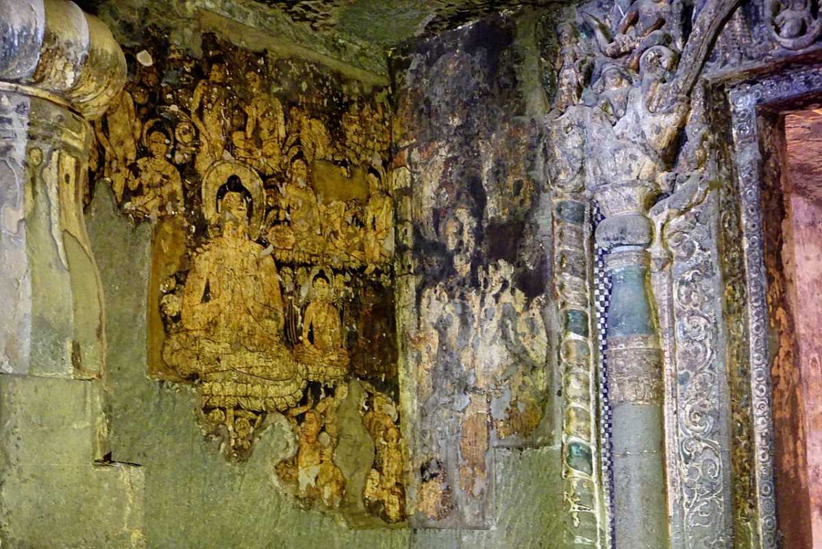 The most intact painting in Cave 6: Buddha seated in dharma-chakra-mudra.