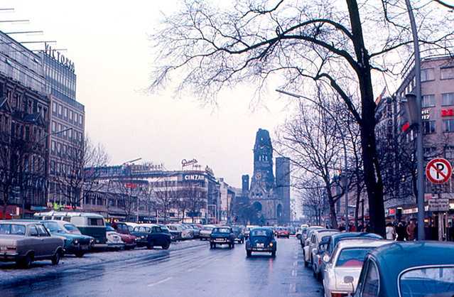 People on their way to visit the Kaiser Wilhelm Memorial Church, Berlin in different vehicles