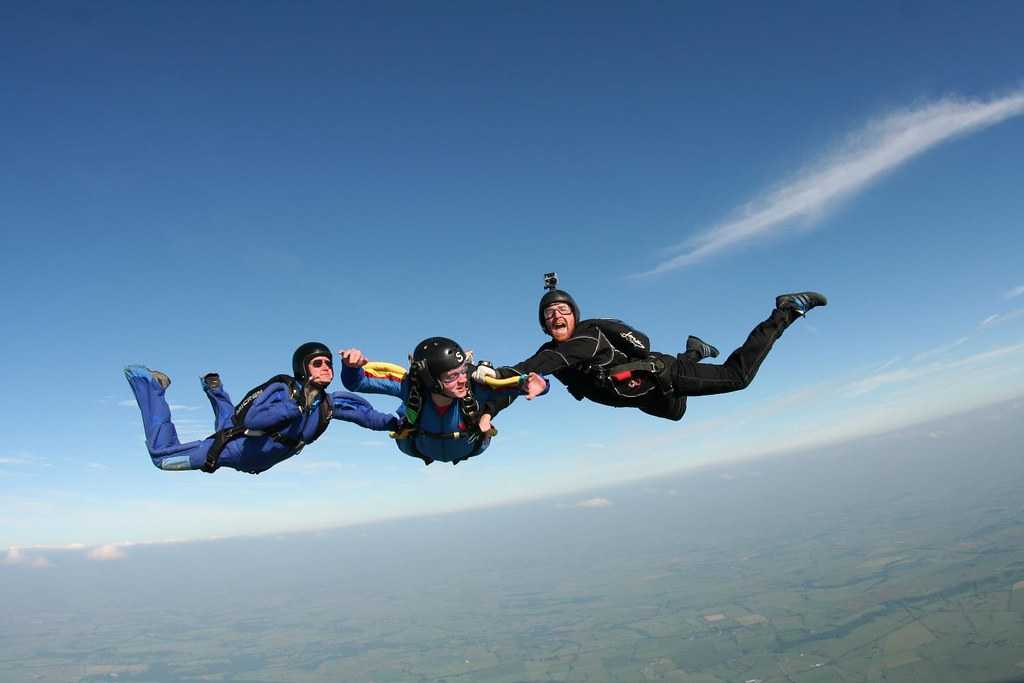 3 people skydiving
