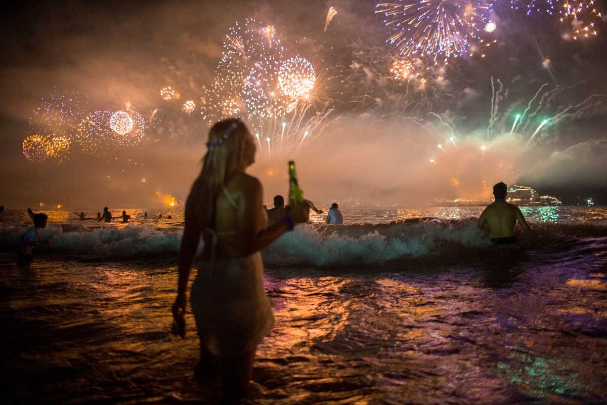 Jumping Waves And Offering Flowers In Brazil