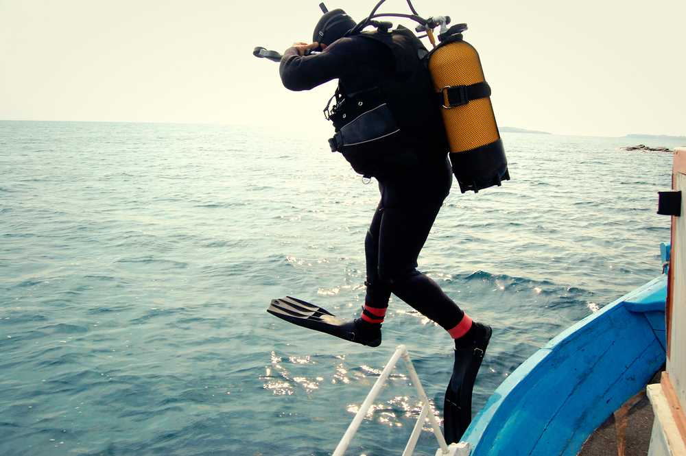 A diver jumping into the sea